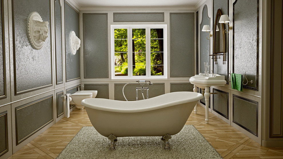 Inspiration for a mid-sized arts and crafts bathroom in Glasgow with a freestanding tub, a wall-mount toilet, beige tile, wood-look tile, grey walls and medium hardwood floors.