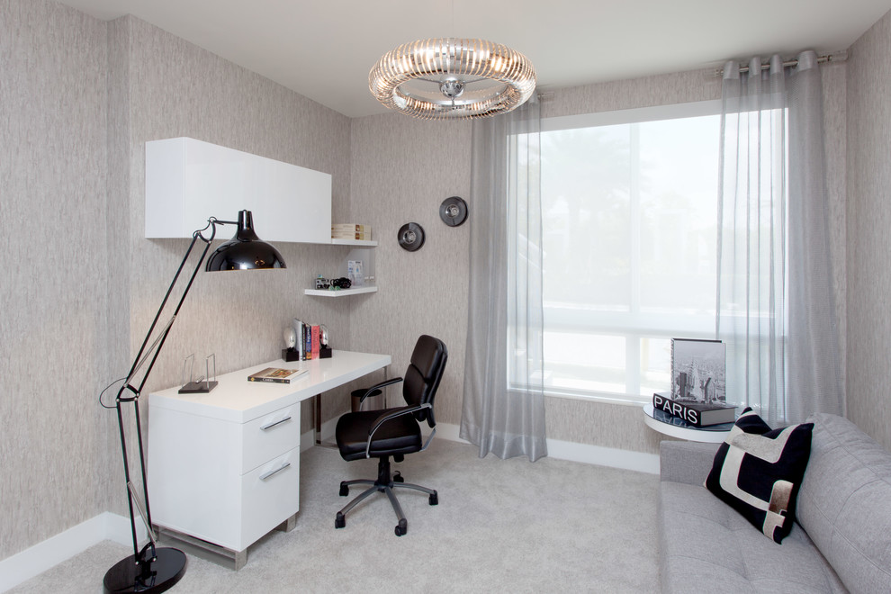 Example of a small minimalist freestanding desk carpeted study room design in Miami with no fireplace