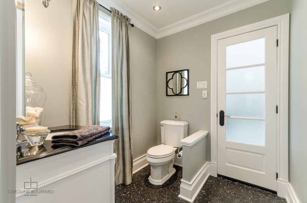 Design ideas for a small traditional 3/4 bathroom in Montreal with beaded inset cabinets, white cabinets, an alcove shower, a two-piece toilet, black tile, subway tile, grey walls, mosaic tile floors, an undermount sink and granite benchtops.