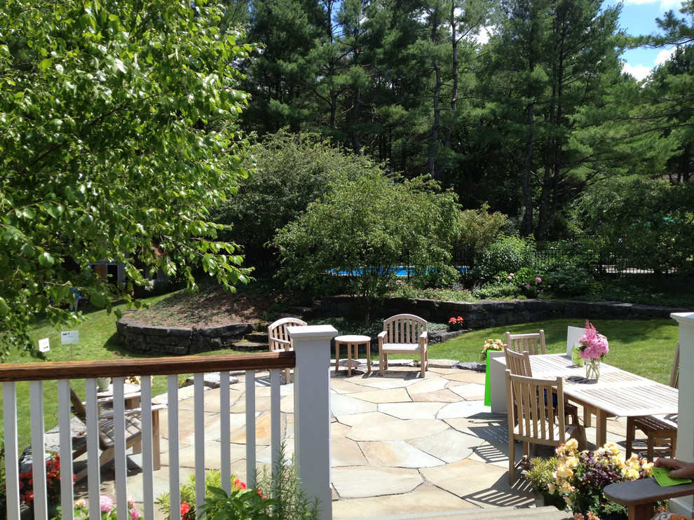 Traditional backyard full sun garden in Burlington with a garden path and natural stone pavers.