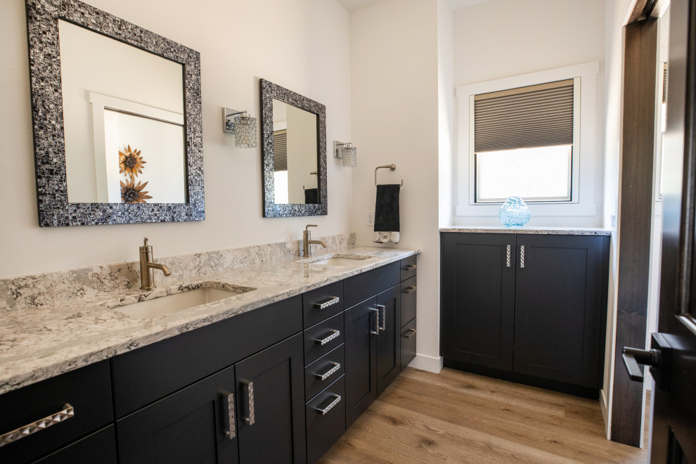 Alcove shower - large transitional master vinyl floor, brown floor and double-sink alcove shower idea in Other with shaker cabinets, dark wood cabinets, an undermount sink, quartz countertops, a hinged shower door, brown countertops, a niche and a built-in vanity