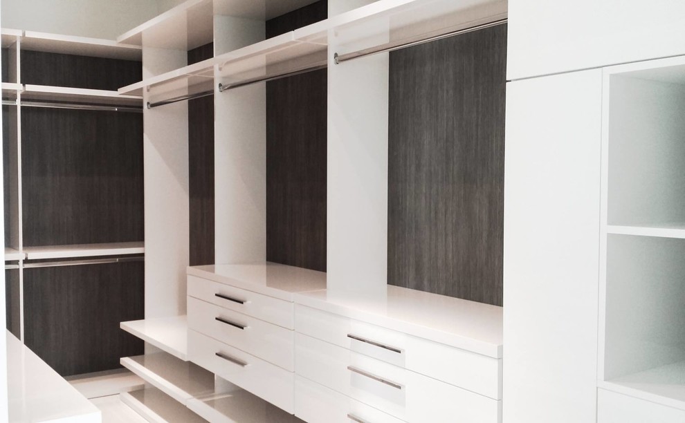 This is an example of a small modern storage and wardrobe in Miami.