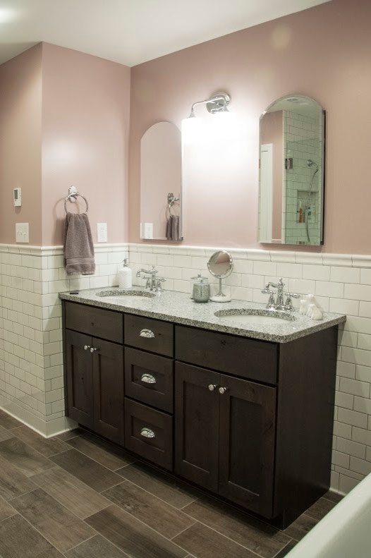 Inspiration for a mid-sized country master bathroom in Nashville with an undermount sink, flat-panel cabinets, dark wood cabinets, granite benchtops, a freestanding tub, a corner shower, a two-piece toilet, gray tile, ceramic tile, white walls and ceramic floors.