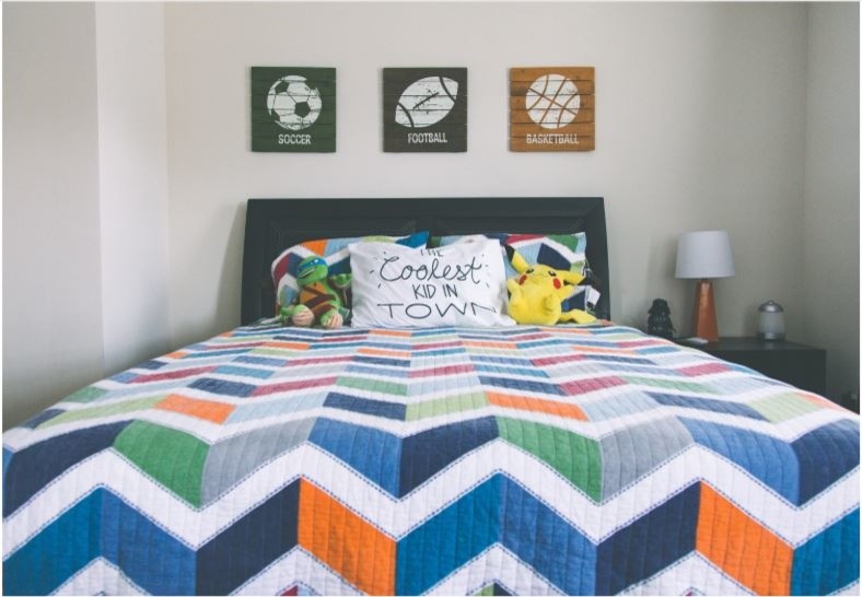 Inspiration for a mid-sized contemporary kids' bedroom for kids 4-10 years old and boys in Charlotte with beige walls, carpet and beige floor.