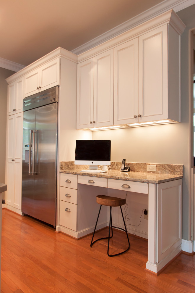 Large transitional medium tone wood floor kitchen photo in DC Metro with an undermount sink, white cabinets, granite countertops, white backsplash, ceramic backsplash and stainless steel appliances