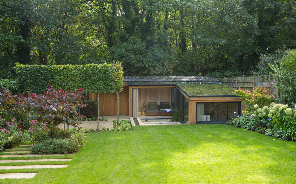 Contemporary one-storey exterior in London with a green roof.