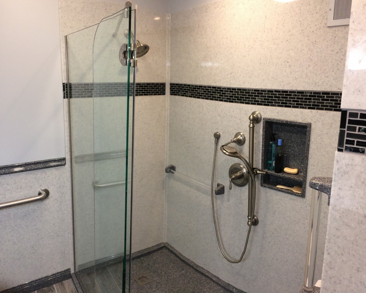 This is an example of a country master bathroom in Wichita with flat-panel cabinets, white cabinets, an open shower, a two-piece toilet, black and white tile, grey walls, ceramic floors, an integrated sink, onyx benchtops, grey floor and a hinged shower door.