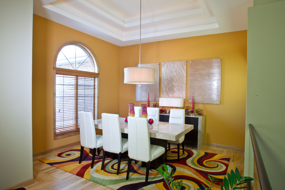 Design ideas for a mid-sized transitional separate dining room in Other with yellow walls, light hardwood floors, no fireplace and yellow floor.