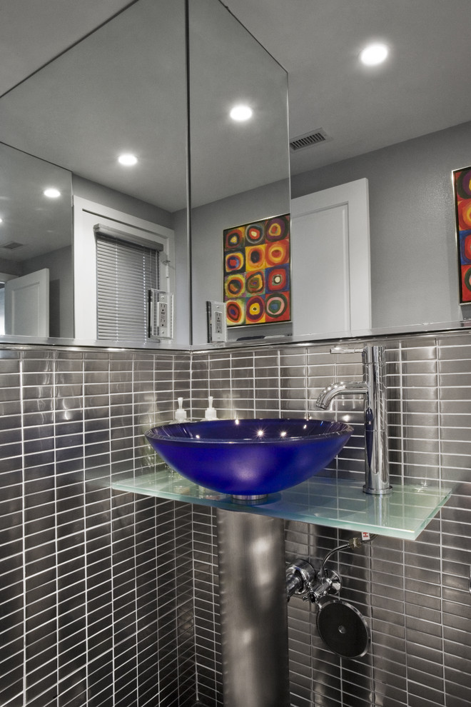 Design ideas for a contemporary bathroom in Los Angeles with glass benchtops and a vessel sink.