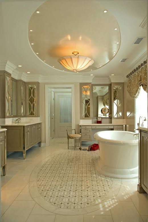 This is an example of a large traditional master bathroom in New York with an undermount sink, flat-panel cabinets, grey cabinets, quartzite benchtops, an alcove shower, a bidet, white walls, marble floors and white tile.