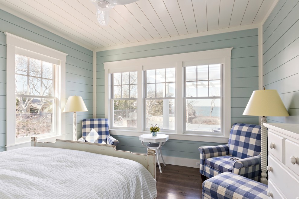 Mid-sized beach style guest bedroom in Boston with blue walls, dark hardwood floors and no fireplace.