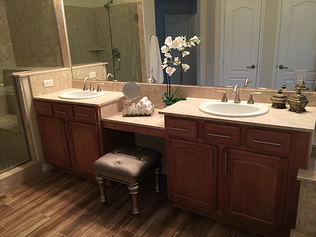 Design ideas for a mid-sized country master bathroom in Las Vegas with flat-panel cabinets, brown cabinets, a drop-in tub, an alcove shower, a two-piece toilet, beige tile, stone slab, beige walls, ceramic floors, a drop-in sink and terrazzo benchtops.