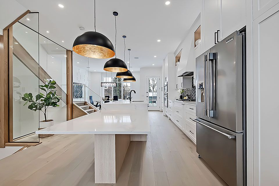 Example of a transitional home design design in Calgary