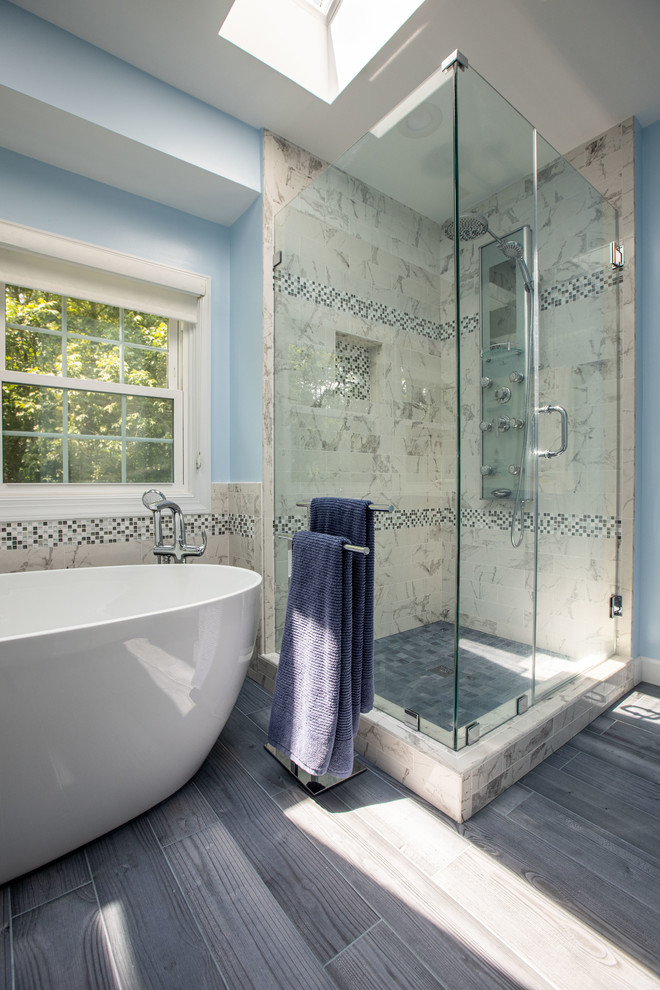 Inspiration for a modern bathroom in DC Metro with blue tile, blue walls, grey floor and blue benchtops.