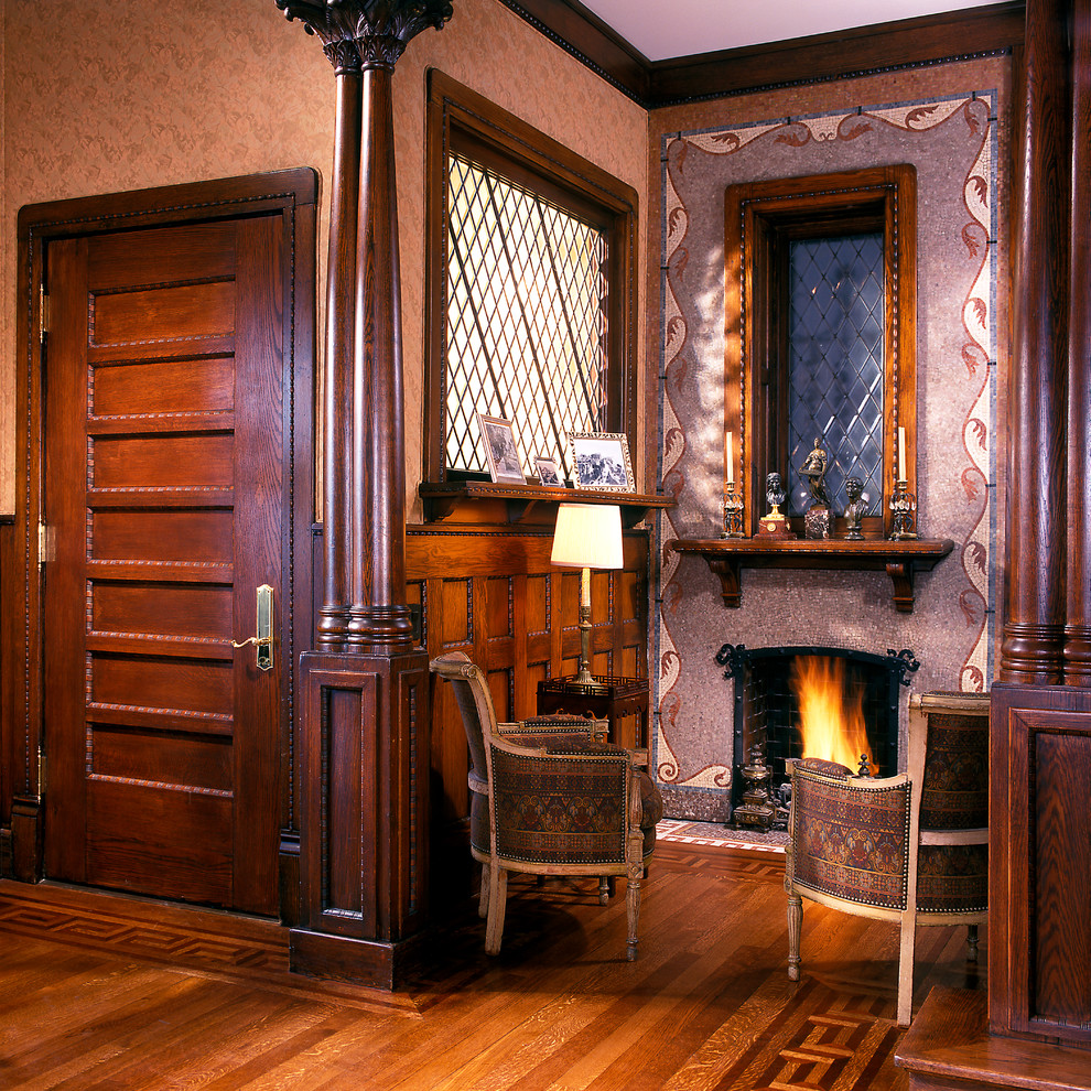 This is an example of a mid-sized eclectic formal enclosed living room in Chicago with dark hardwood floors, no tv, a stone fireplace surround and a standard fireplace.