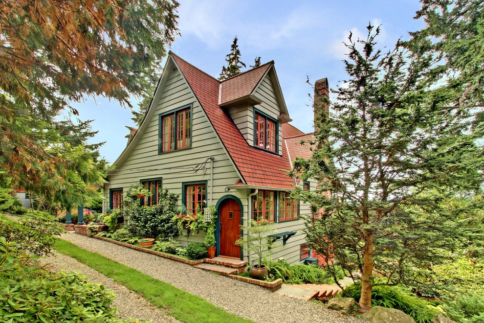 Photo of a large country exterior in Seattle with wood siding.