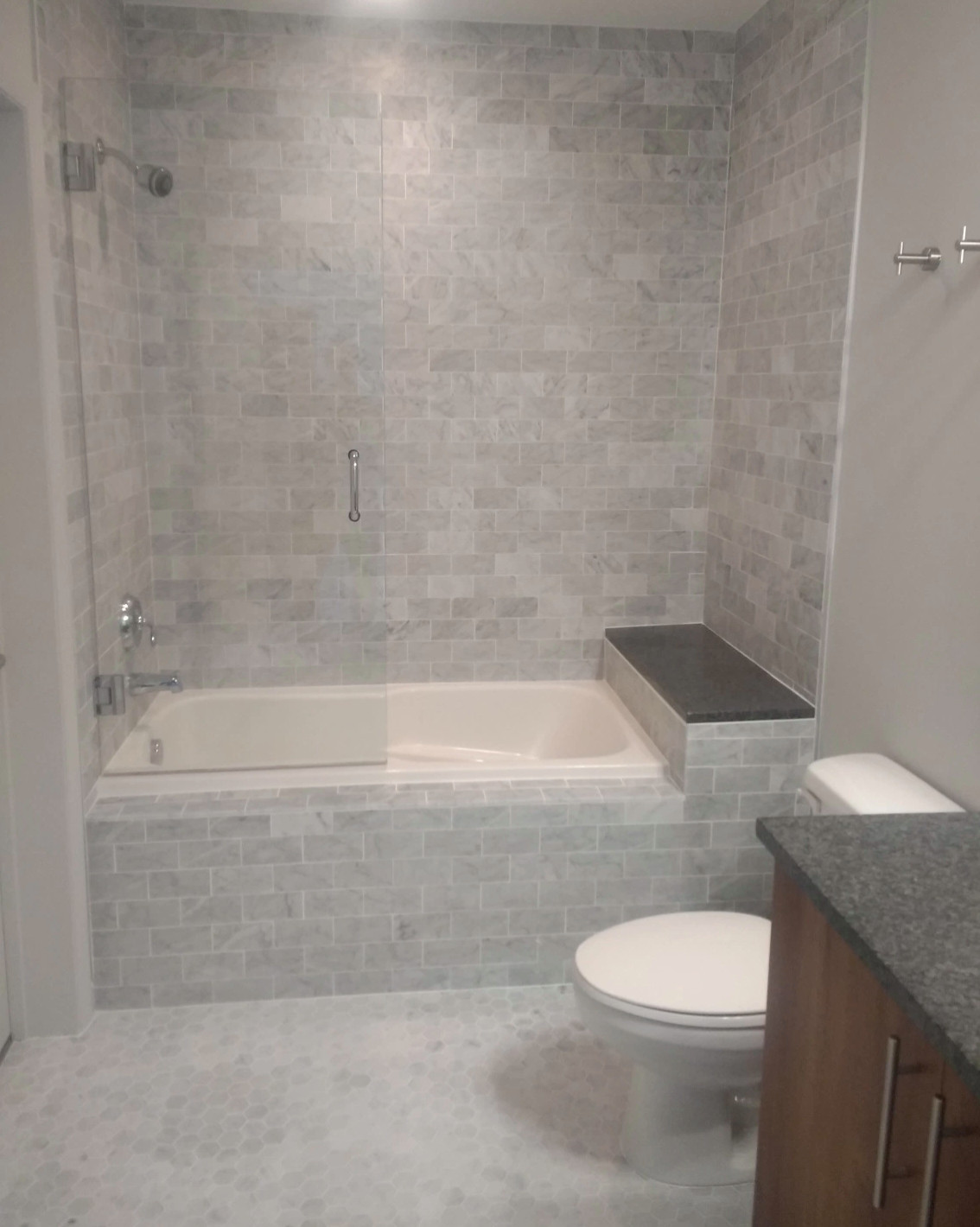 Midtown high-rise marble tile bathroom.