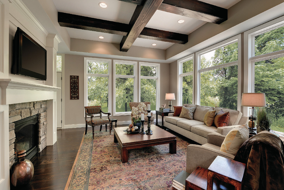 Inspiration for a large transitional formal open concept living room in Raleigh with beige walls, dark hardwood floors, a standard fireplace, a stone fireplace surround and a wall-mounted tv.