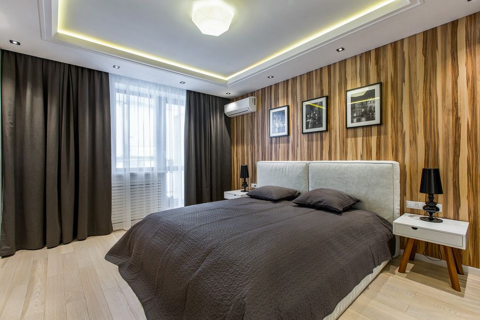 Inspiration for a contemporary master bedroom in Other with brown walls and light hardwood floors.