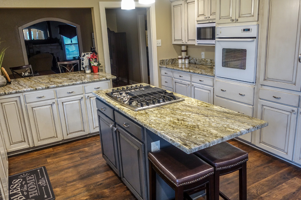 Inspiration for a rustic kitchen remodel in Austin with granite countertops
