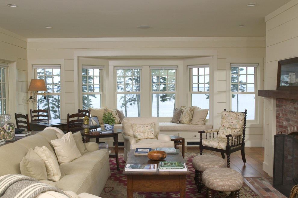 Design ideas for a traditional living room in Boston with white walls.