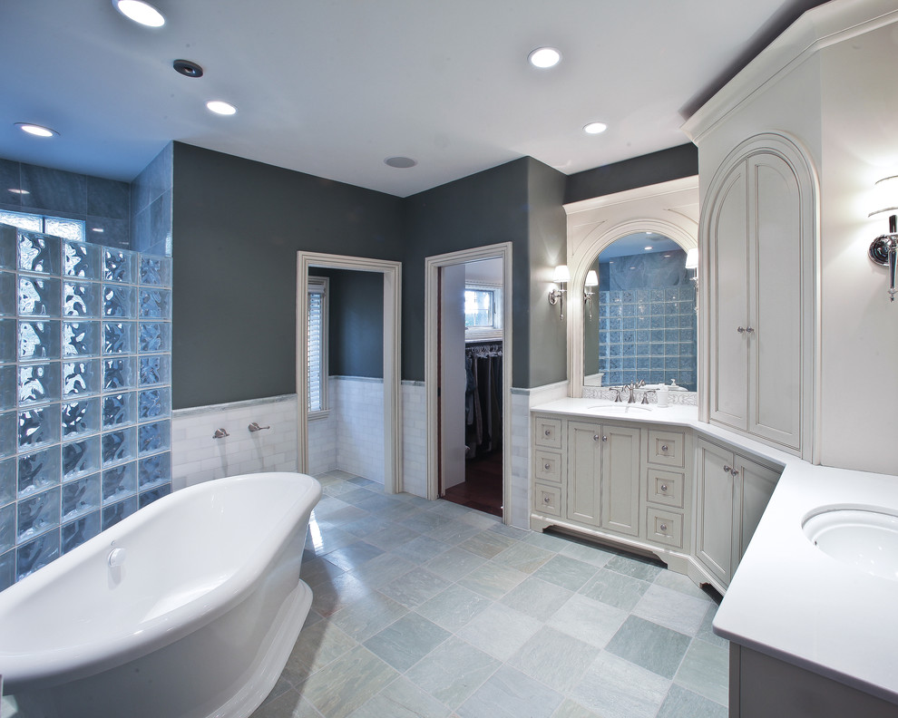 This is an example of an eclectic bathroom in Milwaukee with a freestanding tub.