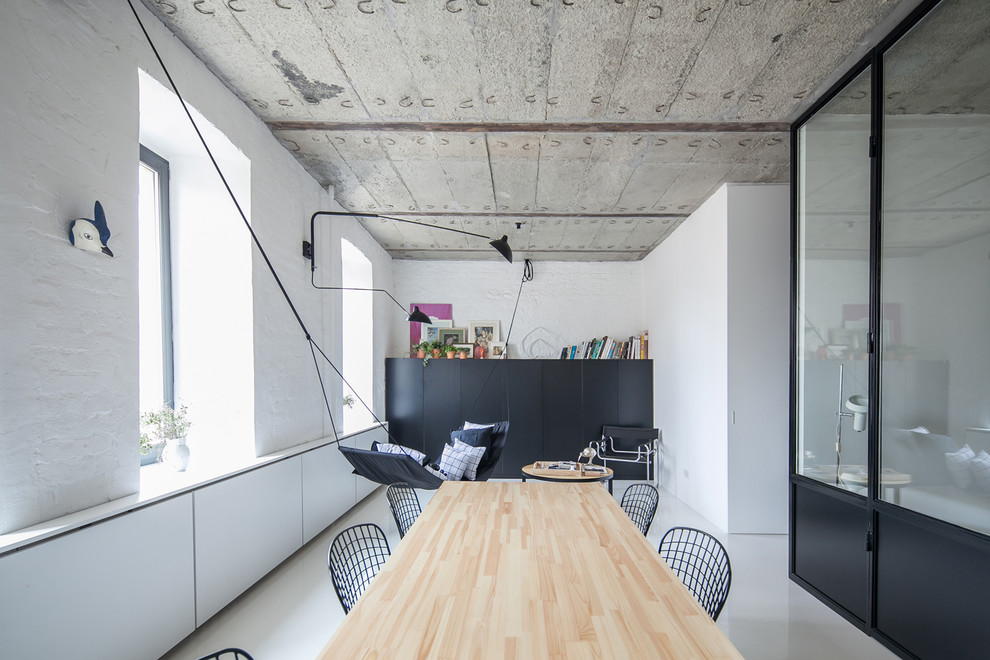 Inspiration for an enclosed dining room remodel in Berlin with white walls