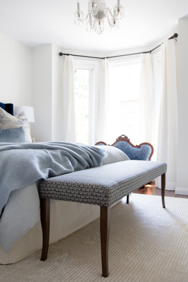 Example of a mid-sized transitional master dark wood floor and brown floor bedroom design in Toronto with white walls