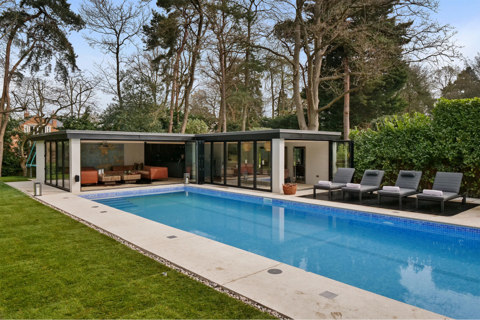 This is an example of a contemporary rectangular pool in Other.