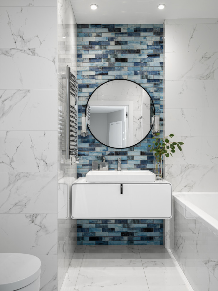 Inspiration for a mid-sized contemporary master bathroom in Saint Petersburg with white cabinets, an alcove tub, a shower/bathtub combo, a wall-mount toilet, white tile, porcelain tile, white walls, porcelain floors, a console sink, solid surface benchtops, white floor, white benchtops, a single vanity and a floating vanity.
