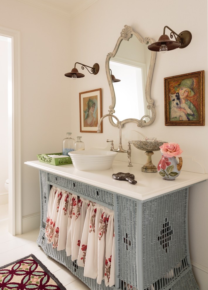 Mid-sized beach style 3/4 bathroom in Los Angeles with a vessel sink, blue cabinets, engineered quartz benchtops, white walls and painted wood floors.