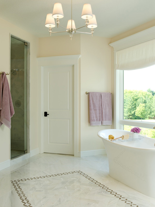 Large traditional master bathroom in Minneapolis with an undermount sink, flat-panel cabinets, white cabinets, marble benchtops, a freestanding tub, a double shower, a two-piece toilet, white tile, stone tile, white walls and marble floors.