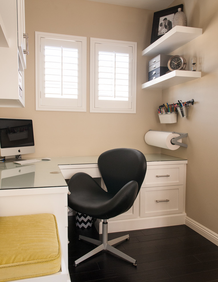 Design ideas for a transitional home office in Orange County with a built-in desk.
