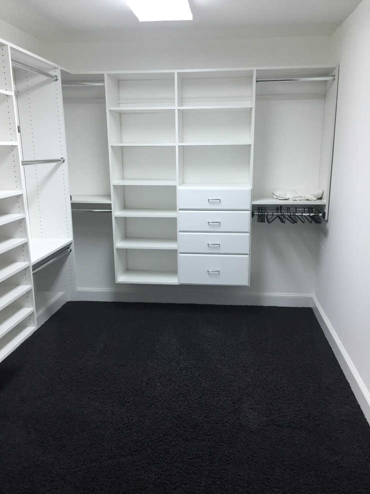 This is an example of a large modern storage and wardrobe in New York.
