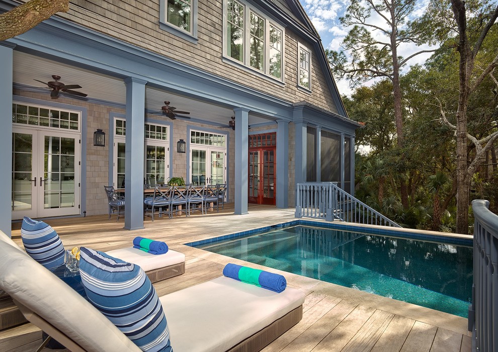 Photo of a beach style rectangular pool in Charleston with decking.