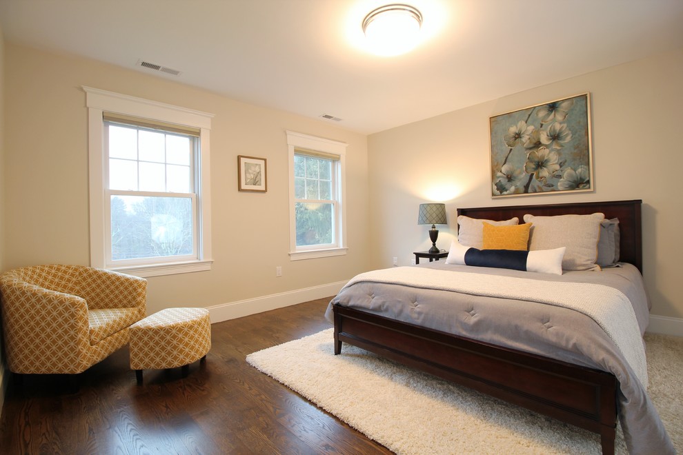 Large transitional guest dark wood floor and brown floor bedroom photo in Boston with beige walls