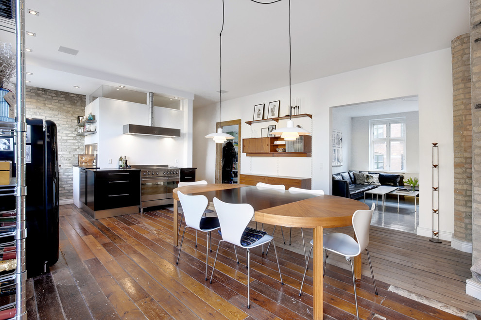 This is an example of a large contemporary kitchen/dining combo in Aalborg with medium hardwood floors and multi-coloured floor.