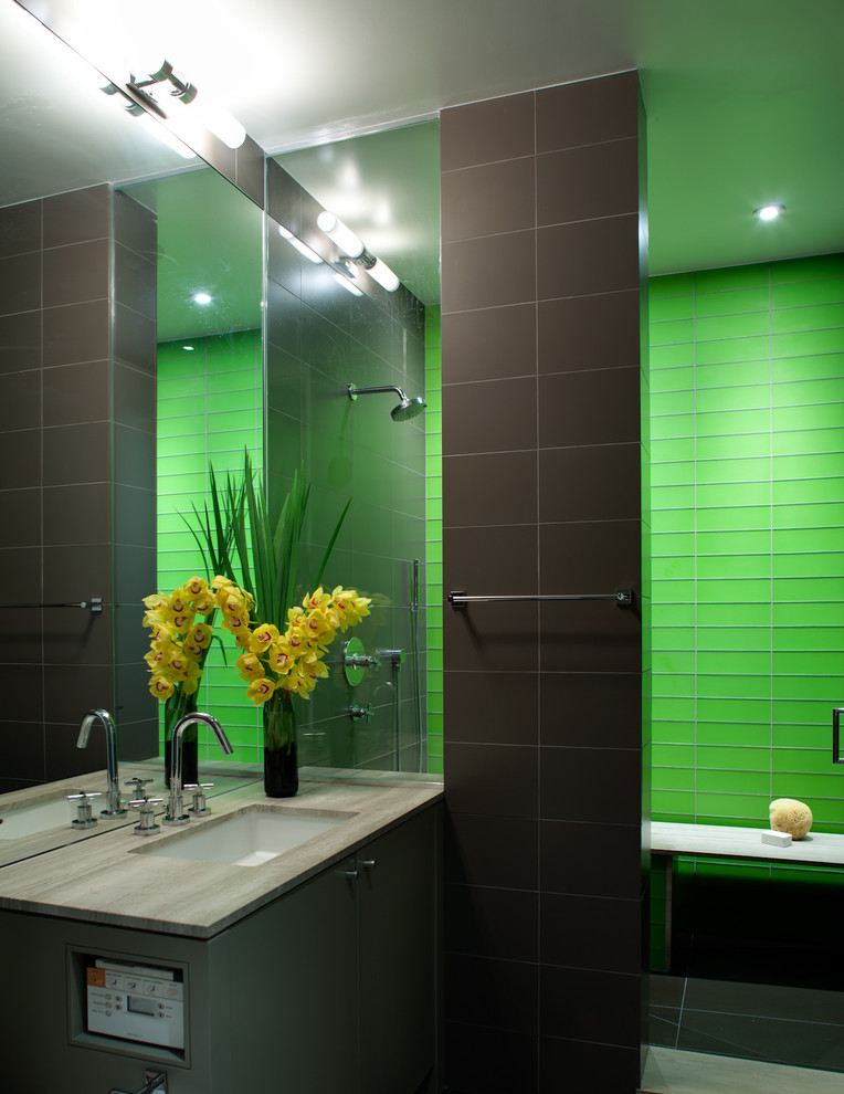 Contemporary bathroom in New York with glass tile and green tile.