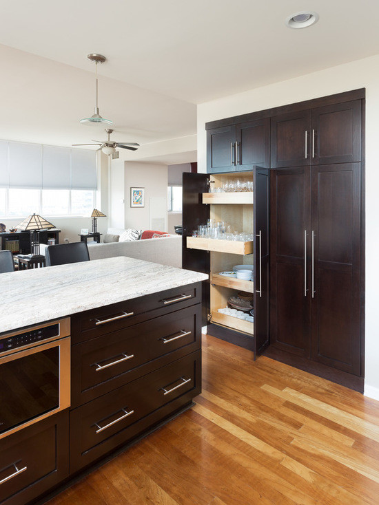 Mid-sized transitional u-shaped medium tone wood floor open concept kitchen photo in Chicago with an undermount sink, shaker cabinets, dark wood cabinets, marble countertops, white backsplash, subway tile backsplash, stainless steel appliances and a peninsula