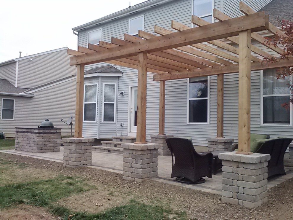 Mid-sized contemporary backyard patio in Columbus with an outdoor kitchen, concrete pavers and a pergola.