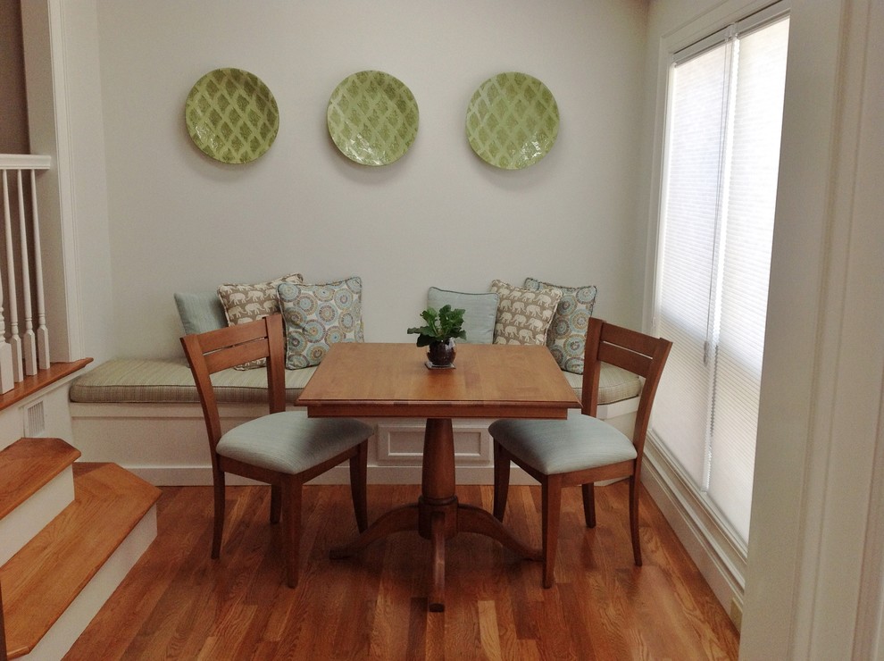 Inspiration for a small transitional medium tone wood floor enclosed dining room remodel in Boston with white walls and no fireplace