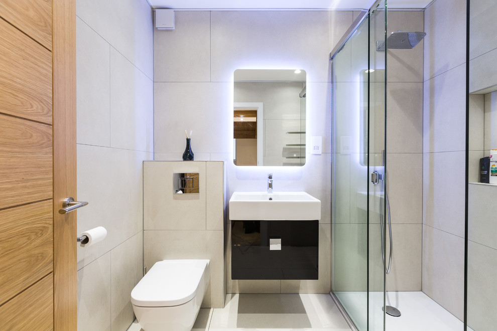 Design ideas for a mid-sized contemporary bathroom in London with flat-panel cabinets and black cabinets.