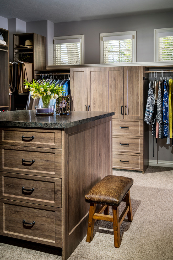 Design ideas for a mid-sized traditional gender-neutral walk-in wardrobe in Other with medium wood cabinets.