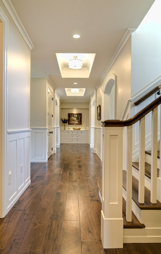 Inspiration for a traditional hallway in Other with brown floor.