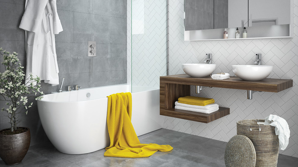 This is an example of a small contemporary kids bathroom in Other with a corner tub, a shower/bathtub combo, gray tile, ceramic tile, grey walls, ceramic floors, grey floor and an open shower.