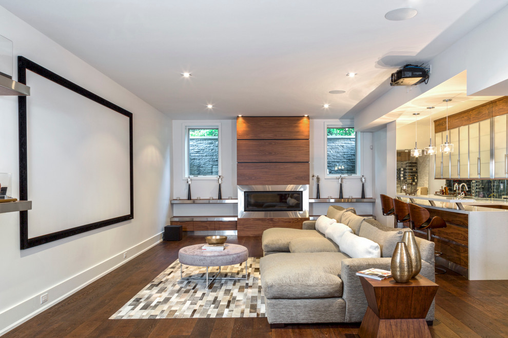 Contemporary open concept home theatre in Toronto with white walls, dark hardwood floors and a projector screen.
