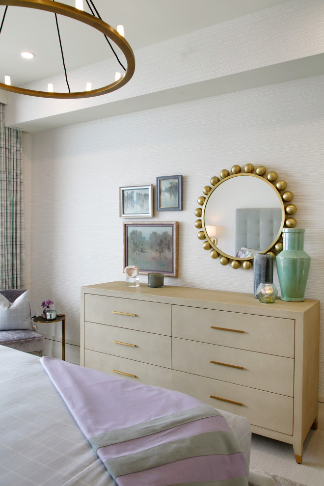 Photo of a mid-sized eclectic guest bedroom in Tampa with beige walls, porcelain floors, beige floor and wallpaper.