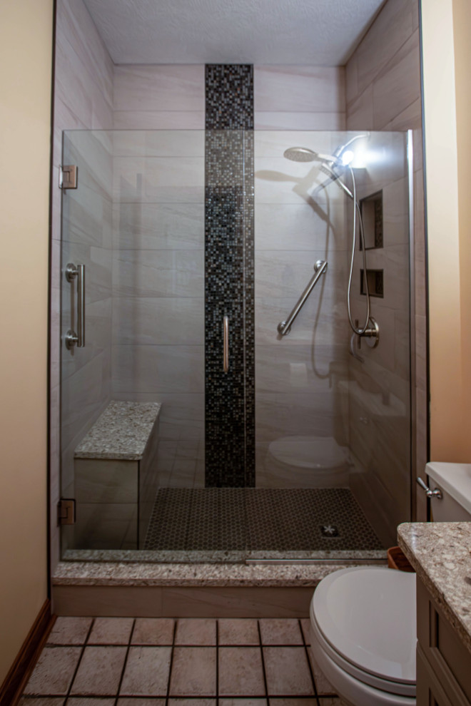 Design ideas for a small transitional master bathroom in Cleveland with an alcove shower, beige walls, porcelain floors, beige floor, a hinged shower door and a niche.