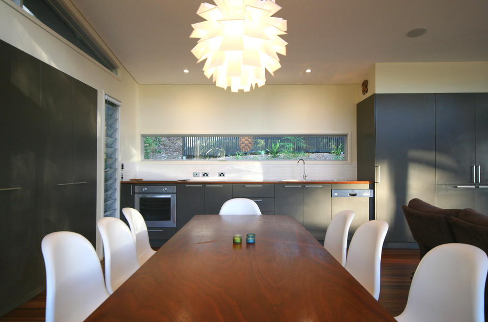 Inspiration for a contemporary dining room in Sydney with white walls.