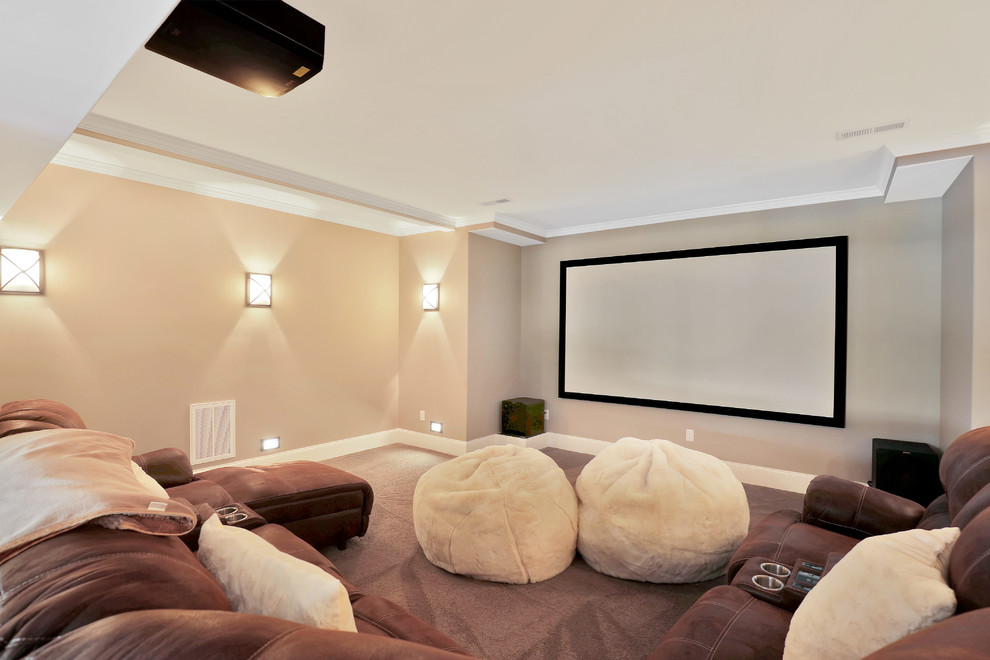 Inspiration for a large transitional enclosed home theatre in Richmond with beige walls, carpet, a projector screen and grey floor.